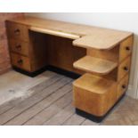 An Art Deco walnut desk, circa 1930, the rectangular top with a central pull-out writing skiver