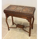 A late 19th century Syrian Damascus mother or pearl and bone parquetry hardwood games table, applied