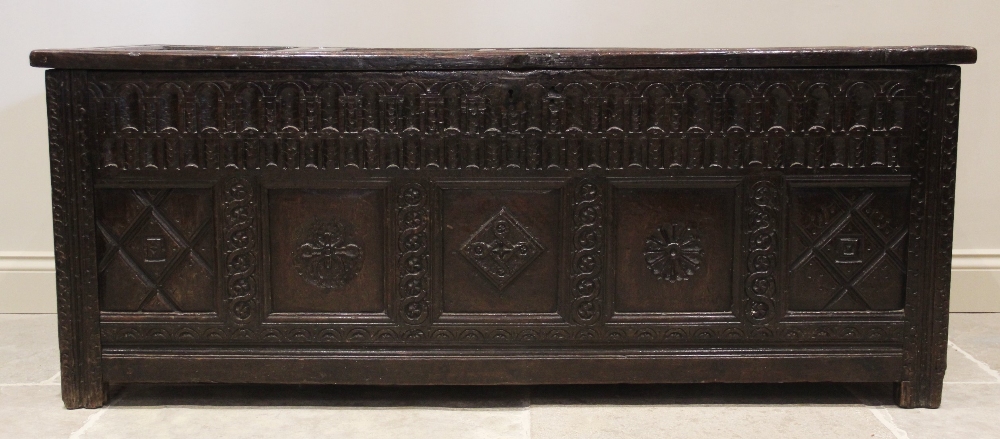 A 17th century oak coffer, the hinged cover with four invert moulded panels above a double nulled - Image 3 of 3