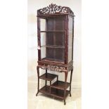 A Hongmu faux bamboo display cabinet on stand, 19th century, the open work intertwined three quarter