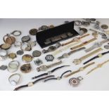 A collection of assorted watch parts, to include mechanical and battery powered movements, straps
