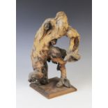 A Chinese root wood carving, of naturalistic free-form, set to a square plinth base, 44cm high