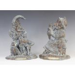 A pair of 19th century brass Punch and Judy door porters, cast in typical profile, 29cm high