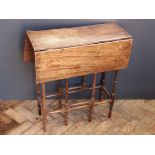 A mid 18th century oval oak drop leaf dining table, raised upon tapering cylindrical legs and pad