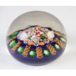 A Millefiore canework paperweight, of spherical form with polished exterior, 8cm wide