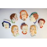Six Art Deco Czechoslovakian wall masks, in the manner of Royal Dux, five modelled as lady's
