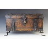 A 17th century style stained oak and iron carriage safe box, the rectangular box with a fall
