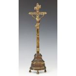 A cast brass crucifix, possibly French, the tall cross with foliate motifs, 'INRI' plaque and