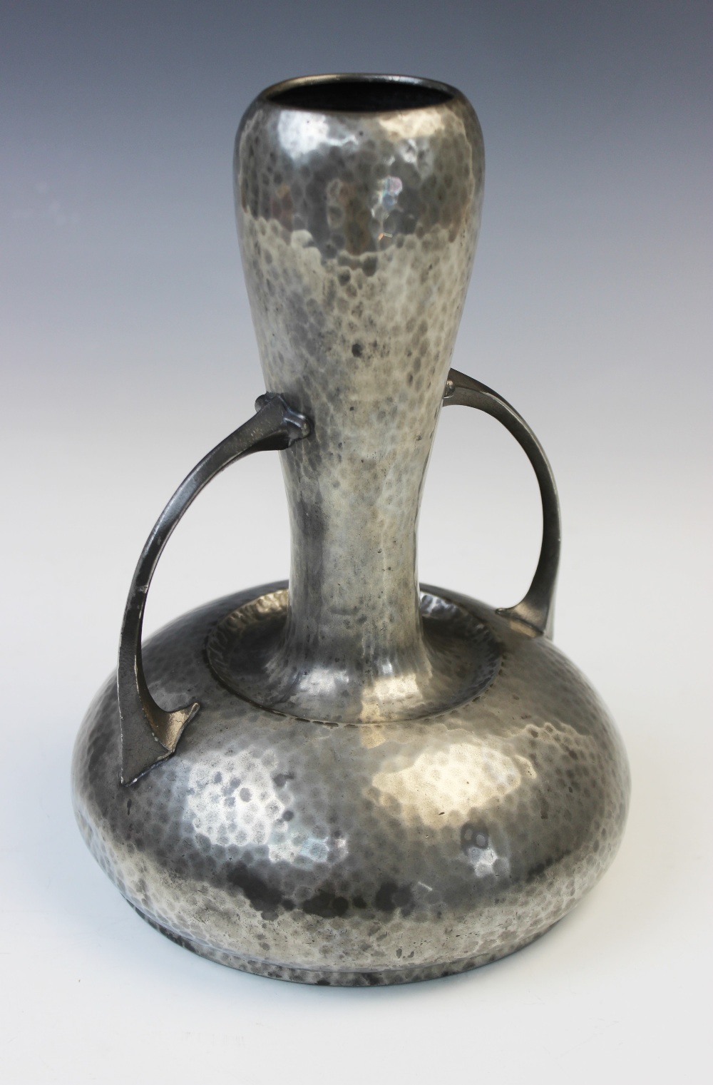 An Art Nouveau pewter vase from the 'Homeland' range by Walker & Co, the hammered body of gourd form - Image 3 of 4