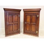 A near pair of 17th century influence oak hanging corner cupboards, each cupboard with a moulded