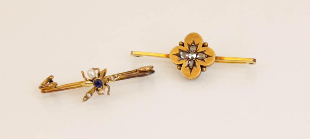 A sapphire and pearl insect bar brooch, the yellow gold body with a mixed cut sapphire set to the