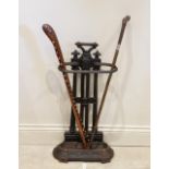 A Victorian cast iron stick stand, of architectural form, the uprights formed as twin cluster