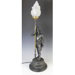 After Philippe Poitevin, a bronze patinated spelter figural table lamp, 20th century, modelled as
