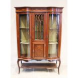 An Edwardian mahogany inlaid display cabinet, the frieze inlaid with linen swags over a central