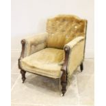 A Victorian walnut and green velour low seat ladies armchair, the break arch button back extending