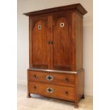 An early 20th century mahogany Arts & Crafts linen press, in the manner of Ambrose Heal, the cavetto