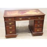 A late 19th /early 20th century mahogany twin pedestal desk, the rectangular moulded top inset