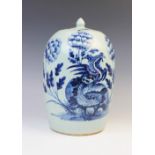 A Chinese porcelain jar and cover, 19th century, externally decorated in blue against a celadon