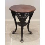 A cast iron and hardwood Britannia type pub table, the circular hardwood top above three cast