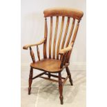 A Victorian elm and beech wood Windsor farmhouse elbow chair, the lath back above a figural elm