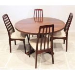 A mid century rosewood pedestal dining table, probably Indian rosewood, the circular table top on an