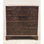 A George III mahogany chest of drawers, the rectangular moulded top over two short and four long