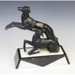 An Art Deco spelter figure, early 20th century, modelled as two deer, one rising, the other leaping,