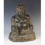 A large 18th/19th century bronze buddha, modelled seated and laughing, with all-over patination