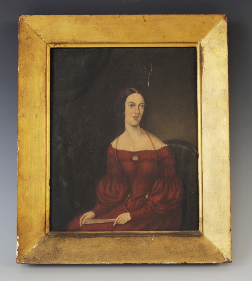 English School (19th century), Naive half length portrait of a lady seated wearing a red dress and