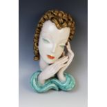 An Art Deco Goldscheider wall mask, early 20th century, modelled as a lady with gold curled hair and