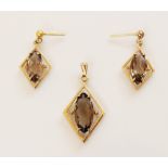 A suite of smokey quartz jewellery, comprising a pendant and a pair of drop earrings, each