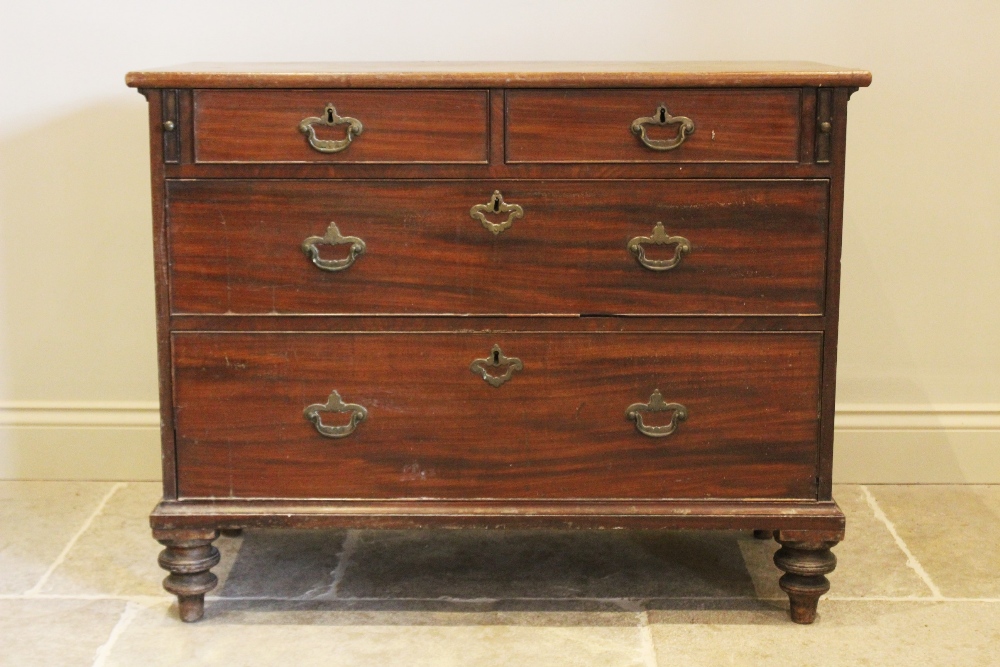 A George III mahogany chest of drawers, later converted from a bureau, the later top above two short