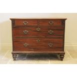 A George III mahogany chest of drawers, later converted from a bureau, the later top above two short