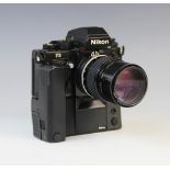 A Nikon F3 35mm SLR camera serial number 1887470, mid 20th century, fitted with a Nikkor 135mm 1: