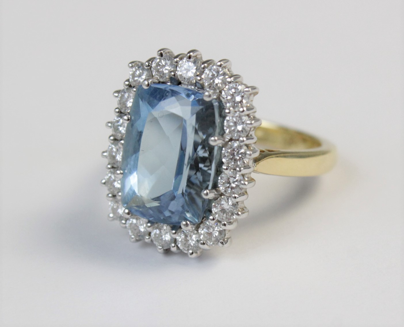 An aquamarine and diamond 18ct gold cluster ring, the central rectangular mixed cut aquamarine ( - Image 4 of 7