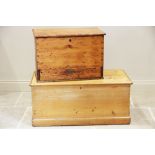 A Victorian pine blanket chest, the hinged cover opening to a fitted candle box, the sides applied