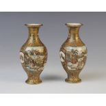 A pair of Japanese satsuma bottle vases, Meiji period (1868-1912), each of baluster form and