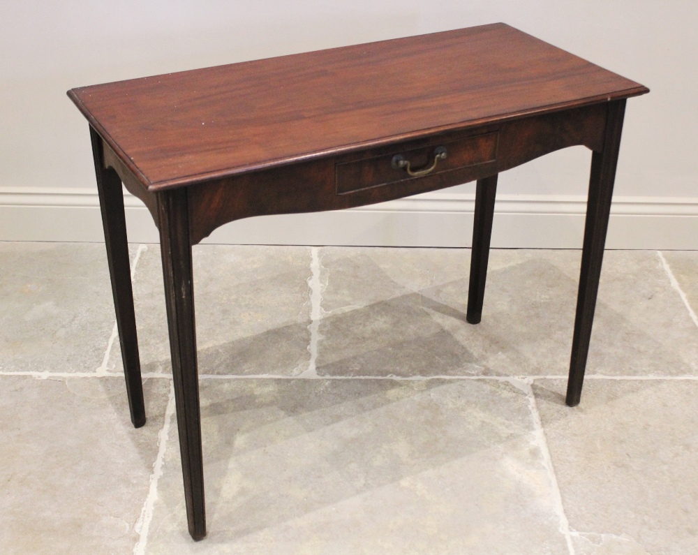 A George III mahogany side table, the rectangular moulded top above a single frieze drawer, raised
