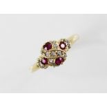 An Edwardian ruby and diamond 18ct gold ring, the quatrefoil head set with four untested round mixed