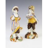 Two Pratt Ware figurines, early 19th century, one modelled as a woman collecting harvest into a