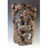 A large Chinese root wood carving, 19th century, depicting multiple monkeys within branches, 60cm