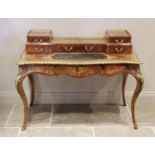 A Louis XVI style figured walnut and marquetry bureau plat, early 20th century, the elevated back