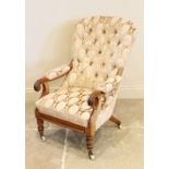 A Victorian upholstered mahogany drawing room chair, the arched button back extending to padded