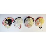 Four Art Deco wall masks by Cope & Co, each modelled as a young lady in profile wearing dark pink,