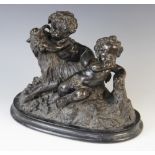 A Grand Tour patinated bronze figural group, 19th century, depicting the infant Bacchus modelled