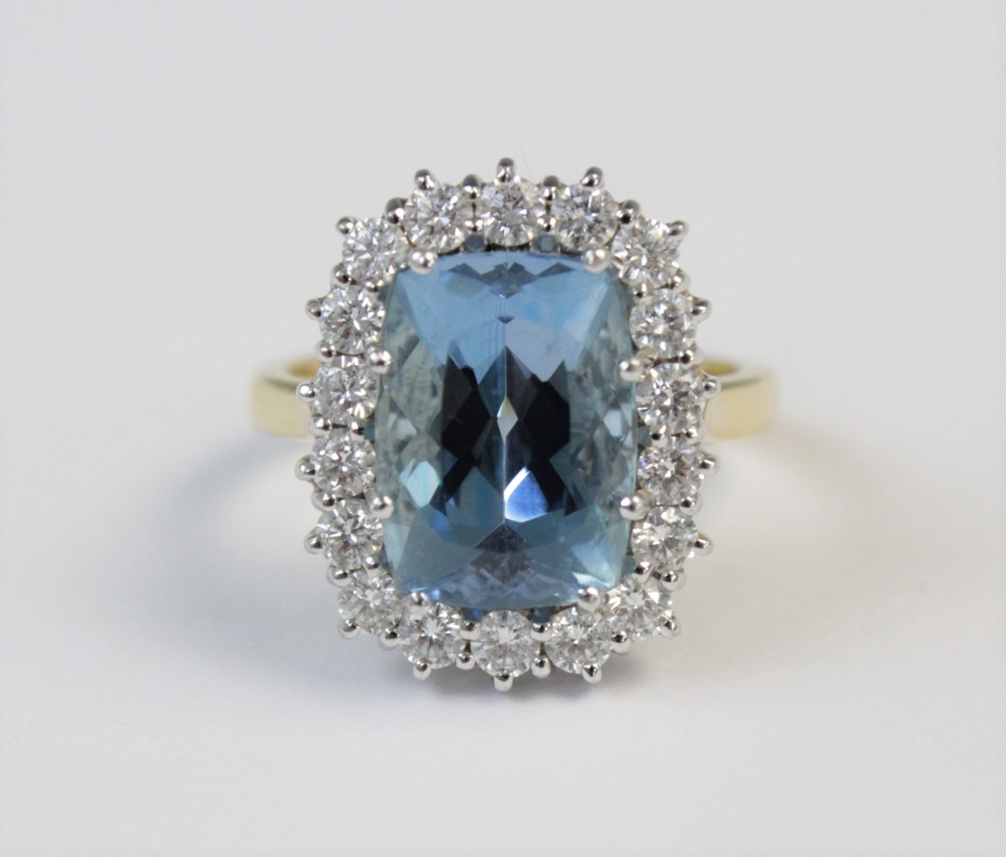 An aquamarine and diamond 18ct gold cluster ring, the central rectangular mixed cut aquamarine ( - Image 2 of 7