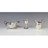 A silver sauce boat by Emile Viner, Sheffield 1957, of typical form with shaped rim and simple