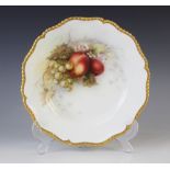 A Royal Worcester hand painted plate by Richard Sebright, centrally decorated with peaches and