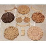 A quantity of carved architectural rose panels and wreaths or garlands in a variety of shapes and