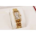 A Cartier Tank Americaine 18ct gold diamond set wristwatch, ref. 1710, the rectangular white dial